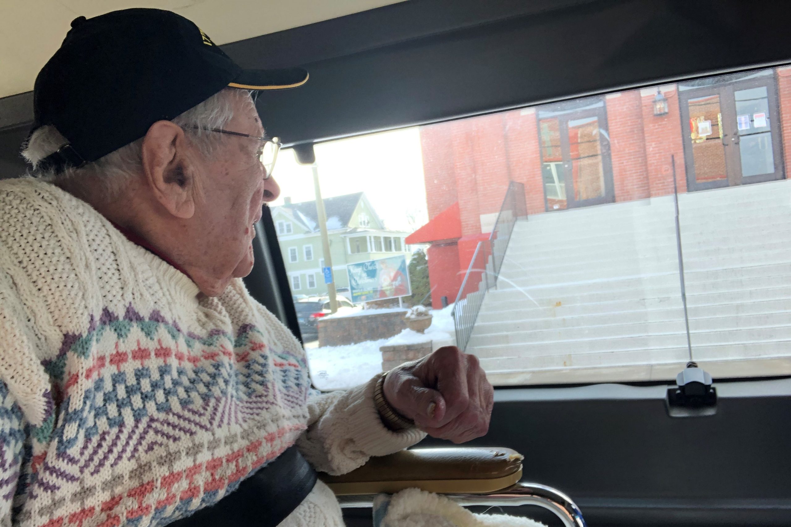 On a tour of his boyhood in Danbury, Ed Siergiej look out the window of an ambulance at Sacred Heart of Jesus Parish, where he, his parents and brother were parishioners.
