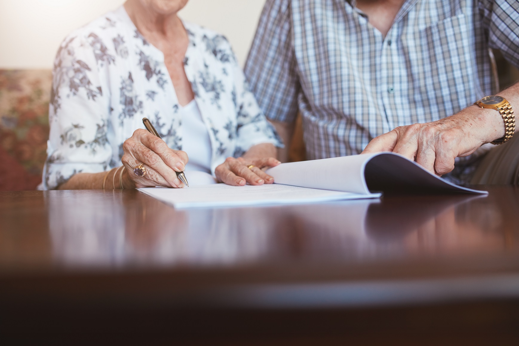 A man and a woman review Advance Care Directive paperwork