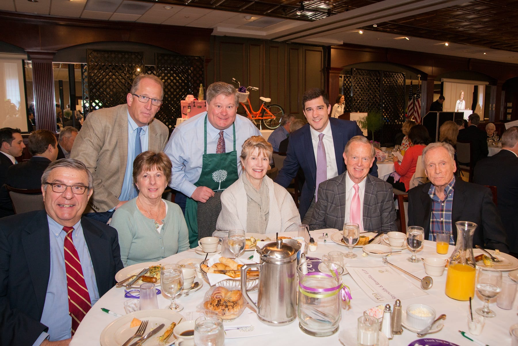 Partners and employees at Reynolds + Rowella, LLP, enjoy coffee and conversation at the 2018 RVNAhealth Spring Breakfast